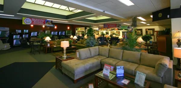 A sofa and furniture on display in a modern home setting